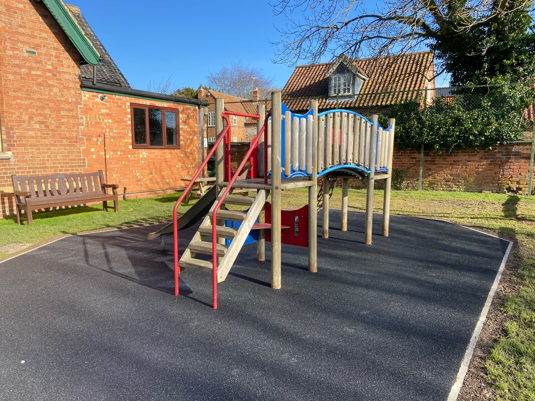 Photograph of new safety surface under children's climbing frame in Granby.